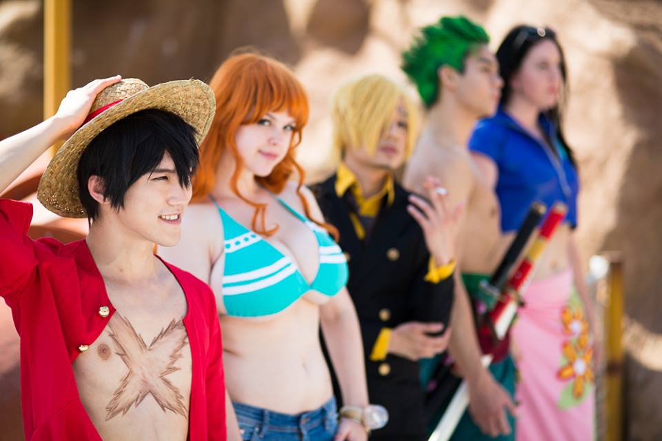 2girls 3boys bikini bikini_top_only breasts cigarette cosplay cropped_jacket flaming-goddess floral_print flower formal_clothes grin hat jacket long_hair monkey_d._luffy monkey_d._luffy_(cosplay) multiple_boys multiple_girls nami_(one_piece) nami_(one_piece)_(cosplay) nami_(one_piece)_(return_to_sabaody) nico_robin nico_robin_(cosplay) nico_robin_(return_to_sabaody) nipples one_piece open_clothes open_shirt orange_hair pantyschatz photo_(medium) pink_skirt red_shirt roronoa_zoro roronoa_zoro_(cosplay) sabaody_archipelago sanji_(one_piece) sanji_(one_piece)_(cosplay) sarong shirt short-sleeved_jacket short_hair short_sleeves skirt smile straw_hat suit swimsuit underboob weapon yellow_shirt