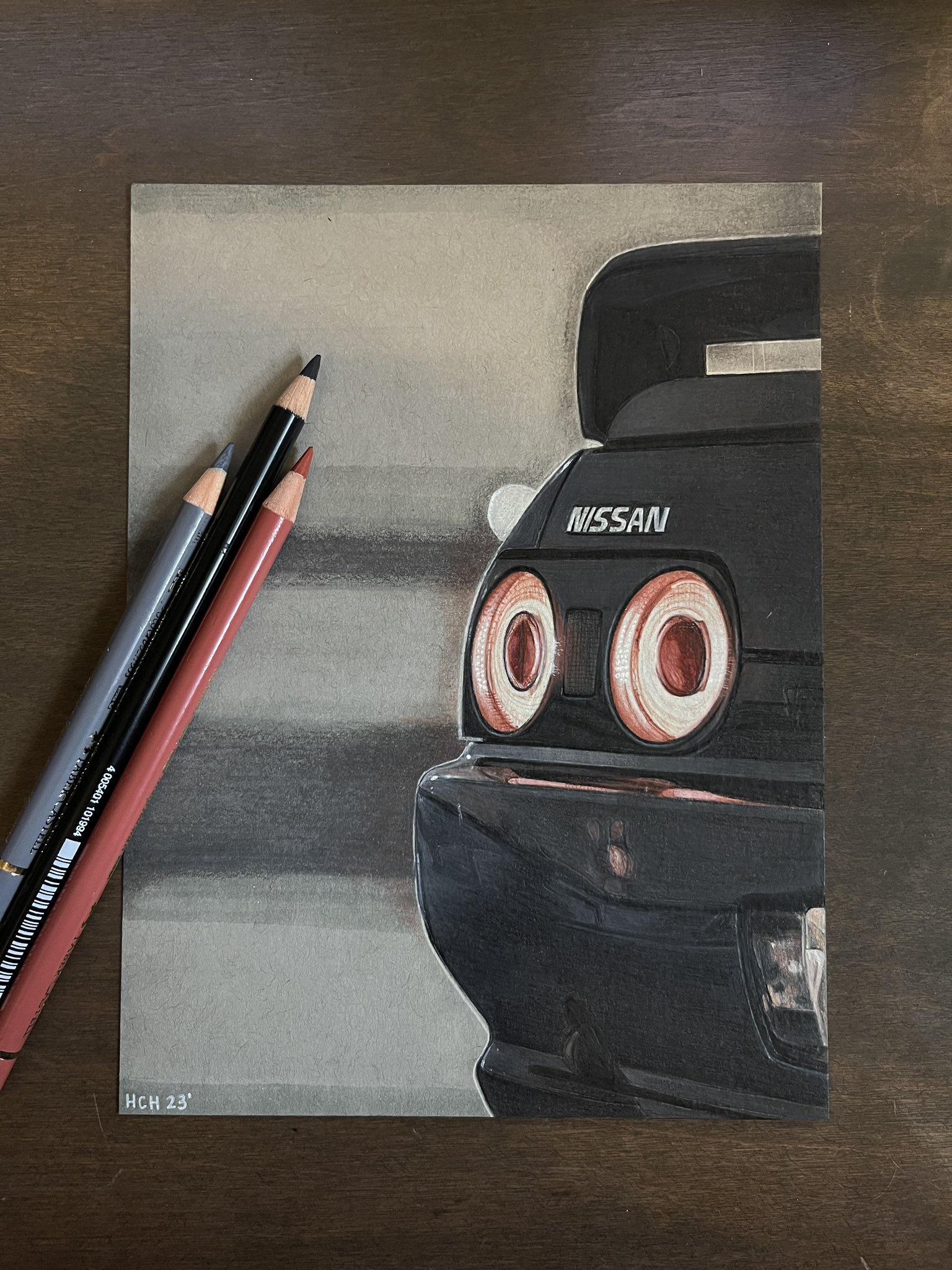 2023 art_tools_in_frame black_car car close-up colored_pencil_(medium) commentary english_commentary hannah_(handrawnby) highres motor_vehicle nissan nissan_skyline nissan_skyline_r32 no_humans original photo_(medium) spoiler_(automobile) traditional_media vehicle_focus
