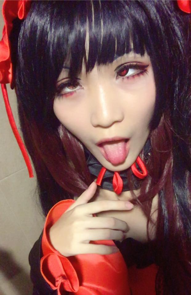 1girl ahegao asian cosplay date_a_live fucked_silly photo_(medium) red_eyes tokisaki_kurumi tokisaki_kurumi_(cosplay) tongue tongue_out yellow_eyes