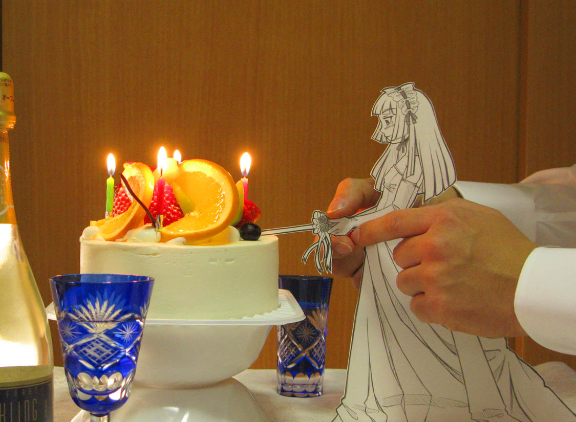 1girl bride cake candle cutting dress food fruit interactive_media lonely mai_waifu orange_(fruit) paper_child papercraft_(medium) pastry photo_(medium) sasaki_yukinojou smile solo_focus sword tears unconventional_media weapon wedding_dress