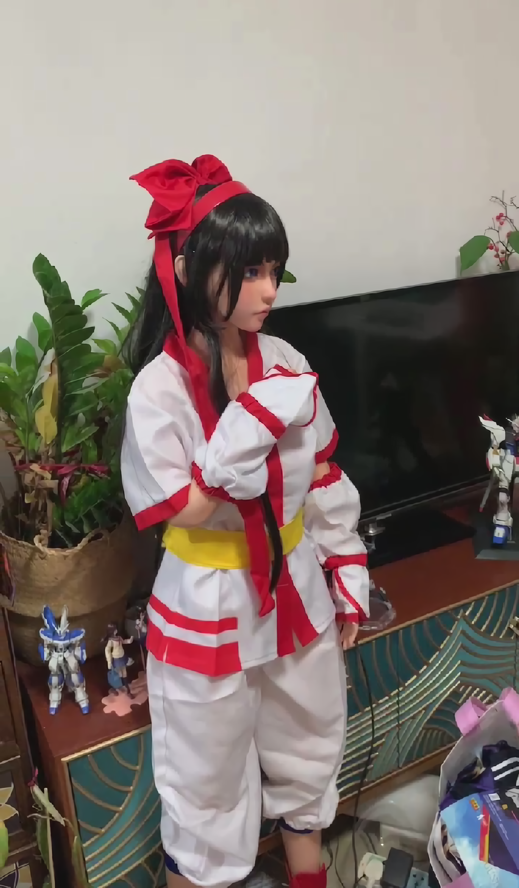 1girl ainu_clothes black_hair blue_eyes breasts doll fingerless_gloves gloves hair_ribbon highres legs long_hair nakoruru pants ribbon samurai_spirits sex_doll small_breasts snk solo the_king_of_fighters thighs