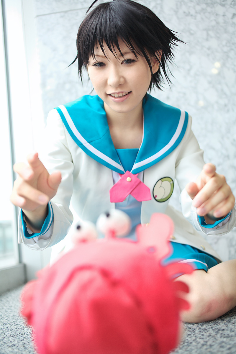 1girl ahoge asian blue_eyes chippi color_contacts cosplay crab female_focus highres idolmaster idolmaster_xenoglossia indoors kikuchi_makoto kikuchi_makoto_(cosplay) photo_(medium) school_uniform serafuku short_hair solo stuffed_animal stuffed_toy