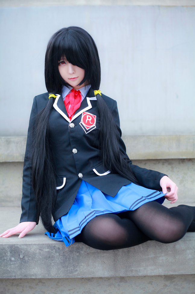 1girl artist_request asian black_hair black_pantyhose blazer blue_skirt blurry color_contacts cosplay date_a_live depth_of_field female_focus hair_over_one_eye jacket long_hair looking_at_viewer on_floor pantyhose photo_(medium) pleated_skirt red_eyes school_uniform sitting skirt solo tokisaki_kurumi tokisaki_kurumi_(cosplay) twintails yokozuwari