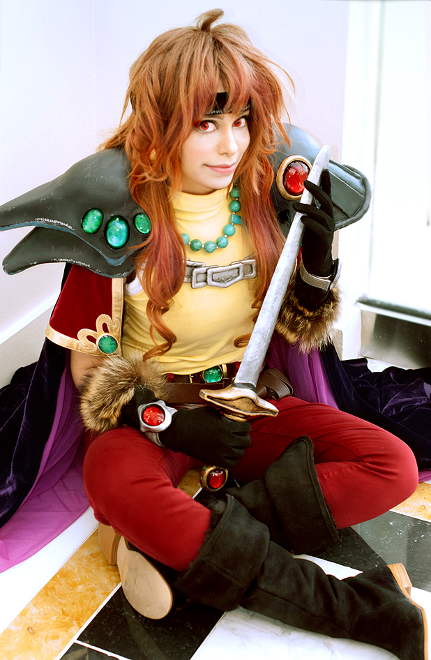 1girl cosplay cosplay_photo gloves lina_inverse photo_(medium) slayers smile sword weapon white_gloves