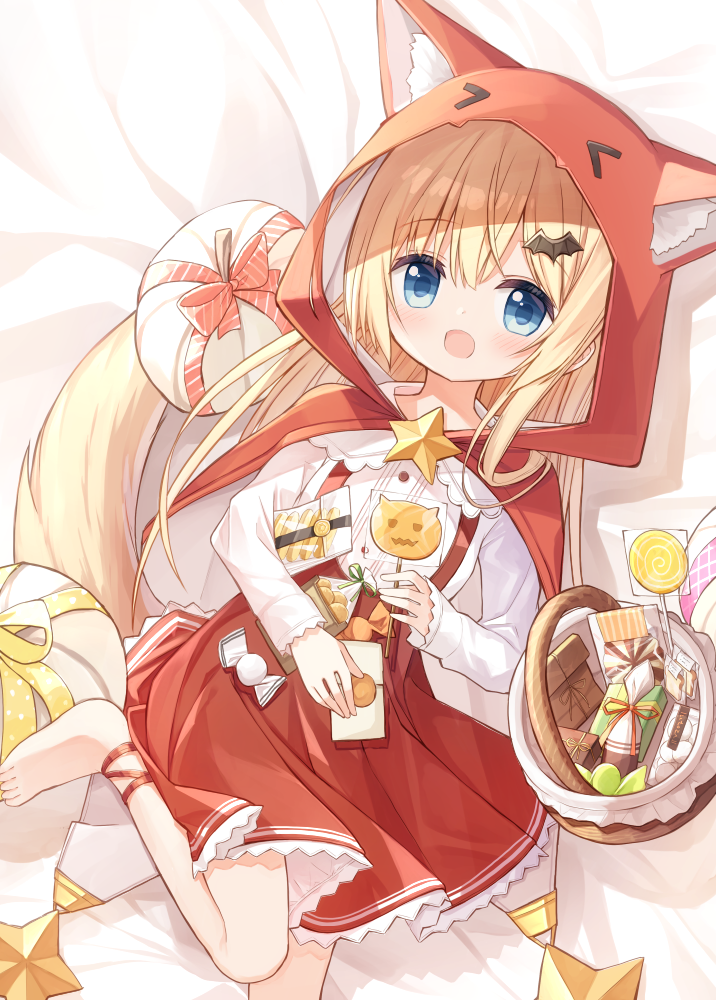 1girl :d animal_ear_fluff animal_ears animal_hood barefoot basket bed_sheet blonde_hair blue_eyes candy capelet fake_animal_ears feet_out_of_frame flower_girl_(yuuhagi_(amaretto-no-natsu)) food hair_between_eyes hair_ornament halloween holding holding_candy holding_food holding_lollipop hood hood_up hooded_capelet lollipop long_sleeves looking_at_viewer lying on_back open_mouth original pleated_skirt red_capelet red_skirt shirt skirt smile solo suspender_skirt suspenders swirl_lollipop tail white_shirt wolf_tail yuuhagi_(amaretto-no-natsu)