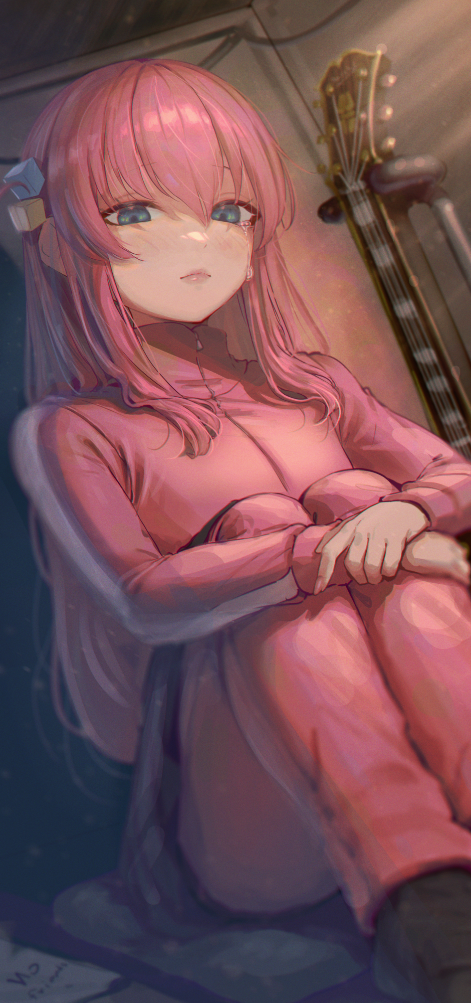 1girl aqua_eyes black_skirt blush bocchi_the_rock! closed_mouth commentary cube_hair_ornament english_commentary fingernails gotoh_hitori guitar hair_between_eyes hair_ornament highres instrument jacket knees_up long_hair long_sleeves looking_at_viewer one_side_up pants pants_under_skirt pink_hair pink_jacket pink_lips pink_pants samlooop sitting skirt solo tears track_jacket