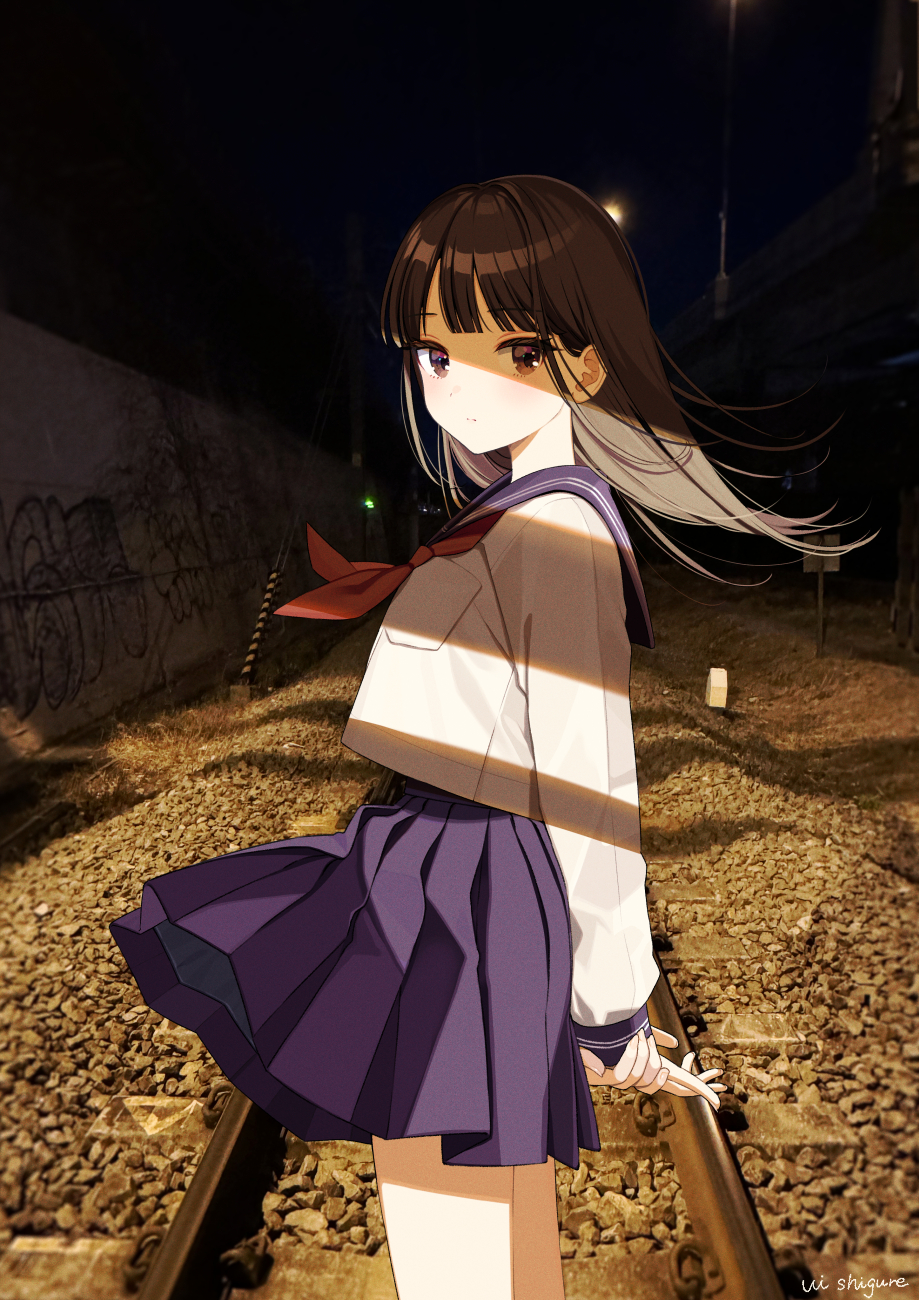 1girl arms_behind_back black_eyes black_hair blue_sailor_collar blue_skirt blunt_bangs breast_pocket choppy_bangs closed_mouth commentary_request expressionless floating_hair from_side highres long_hair looking_at_viewer neckerchief night original outdoors photo_background pleated_skirt pocket railroad_tracks red_neckerchief sailor_collar school_uniform serafuku shigure_ui shirt skirt solo standing white_shirt