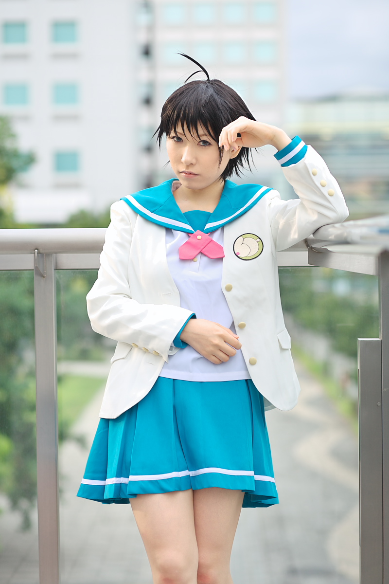 1girl ahoge asian black_hair blue_eyes chippi color_contacts cosplay female_focus highres idolmaster idolmaster_xenoglossia kikuchi_makoto kikuchi_makoto_(cosplay) looking_at_viewer outdoors photo_(medium) school_uniform serafuku short_hair solo
