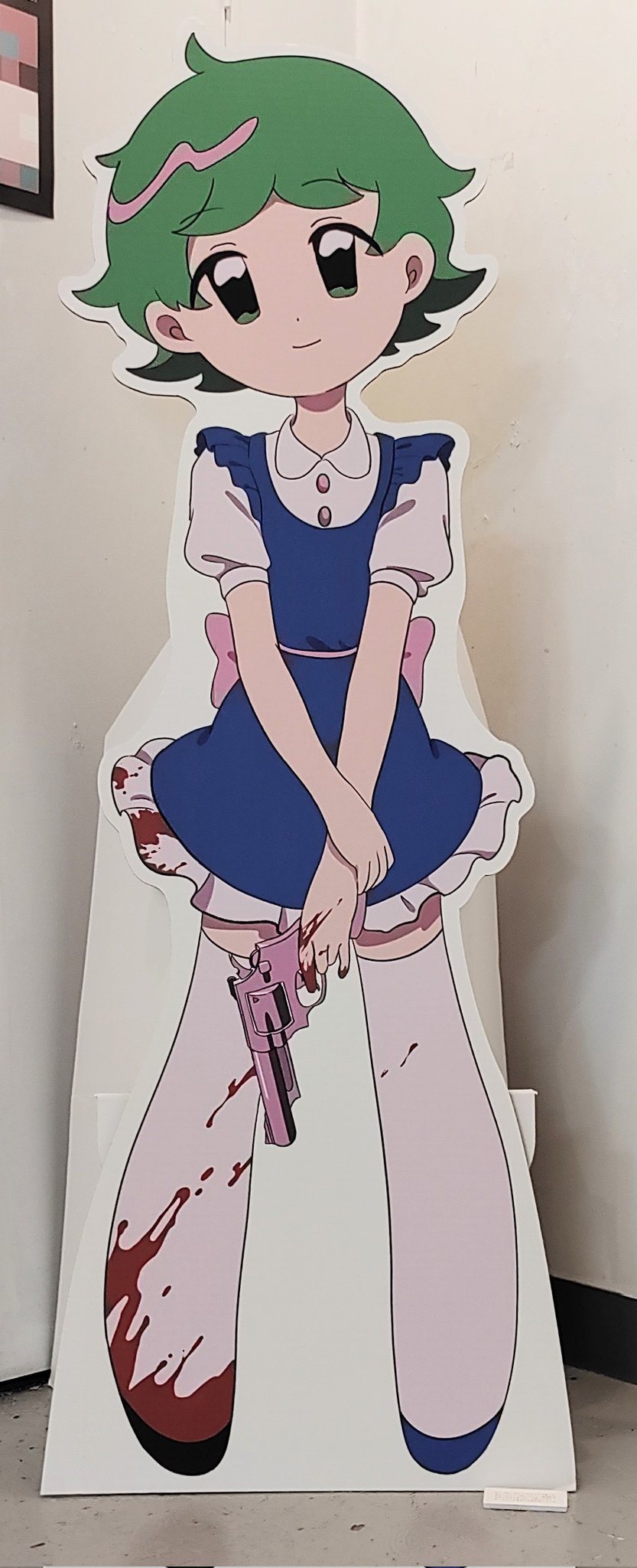 1girl blood blood_on_clothes blood_on_hands blue_dress cardboard_cutout closed_mouth dress frilled_dress frills full_body green_hair gun handgun highres holding holding_gun holding_weapon legs_apart looking_at_viewer momoe_(mme_daigaku) original photo_(medium) revolver shirt short_dress short_hair short_sleeves smile solo standing thighhighs weapon white_shirt white_thighhighs