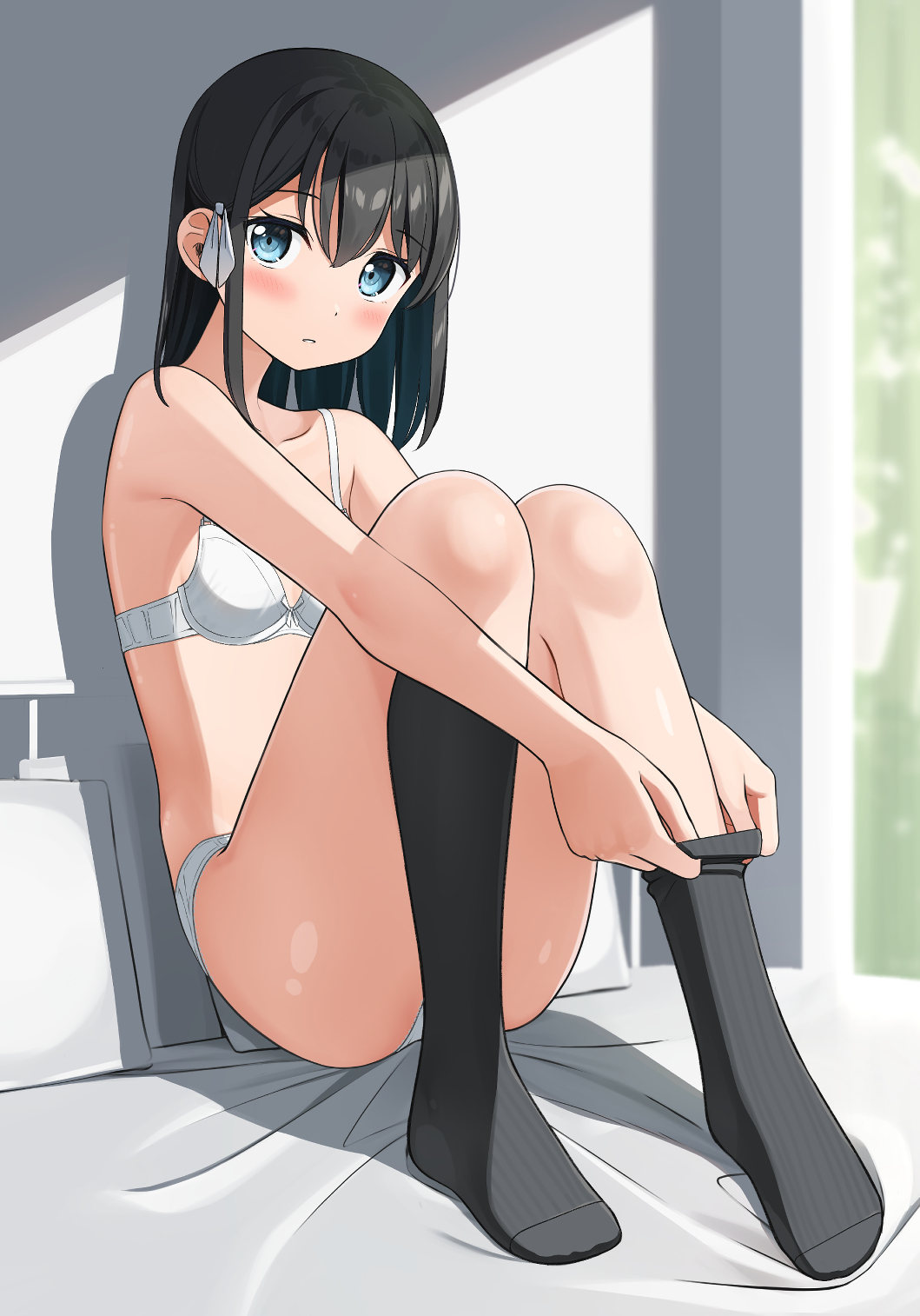 1girl apollo_(hu_maple) bare_arms bare_shoulders bed black_hair black_socks blue_eyes blush bow bra breasts collarbone commentary_request hair_bow highres knees_up long_hair looking_at_viewer no_shoes on_bed original panties parted_lips reclining removing_legwear sitting small_breasts socks solo underwear undressing white_bow white_bra white_panties