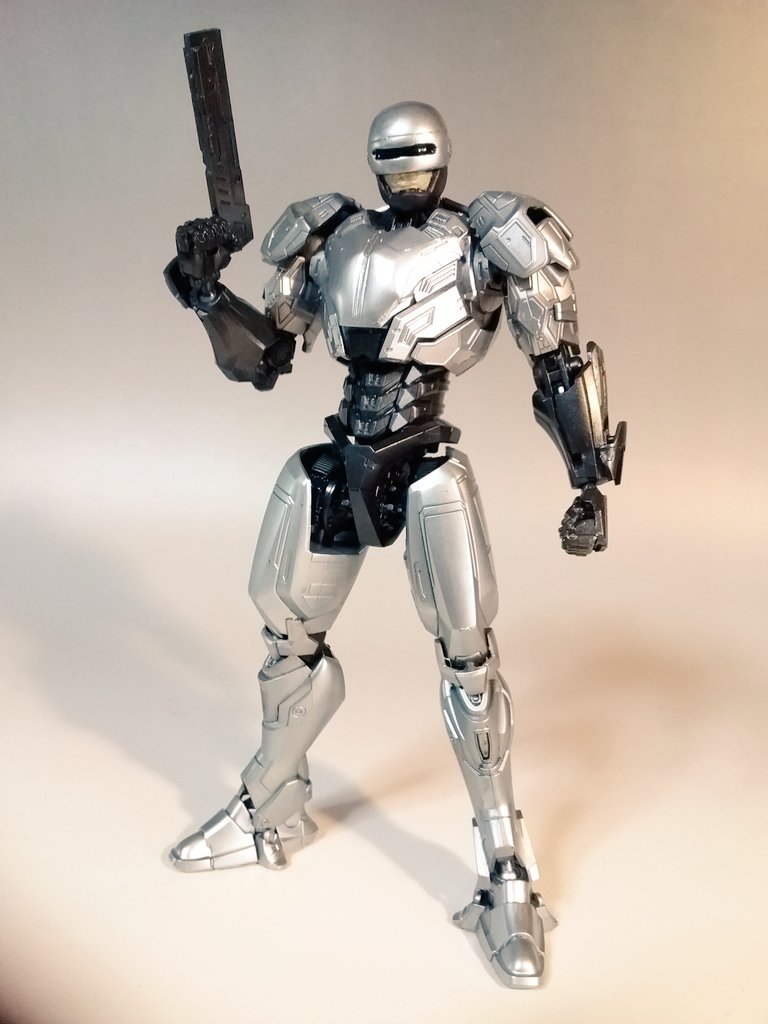 auto-9 autocannon burst_fire_gun burst_fire_pistol cannon clenched_hand fusion gipsy_avenger gun handgun holding holding_gun holding_weapon jaeger_(pacific_rim) looking_ahead male_focus mecha model_kit model_kit_(medium) pacific_rim pacific_rim_uprising pan_pacific_defense_corps photo_(medium) pistol robocop robocop_(character) robot solo standing submachine_gun takamoriko_(takamo) unconventional_media weapon