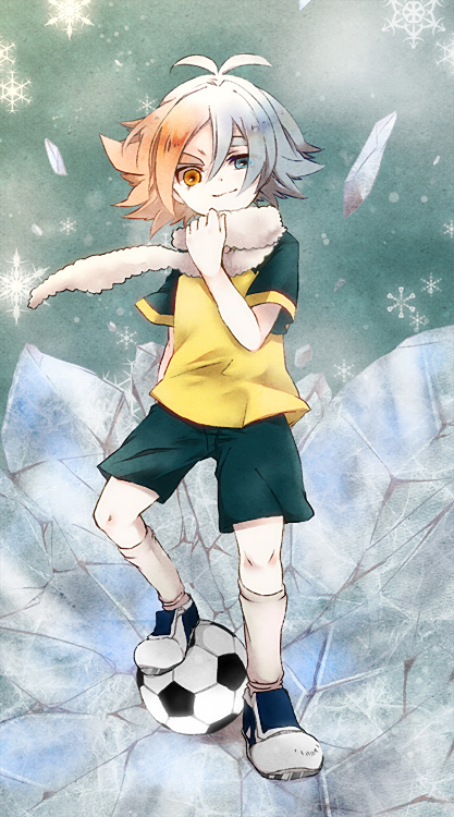 1boy ahoge ball black_shorts black_sleeves blue_eyes blue_hair closed_mouth commentary_request fubuki_shirou full_body gradient_hair heterochromia ice inazuma_eleven inazuma_eleven_(series) looking_at_viewer male_focus multicolored_hair orange_eyes orange_hair raglan_sleeves shirt shorts smile soccer_ball solo standing uru_uzuki yellow_shirt