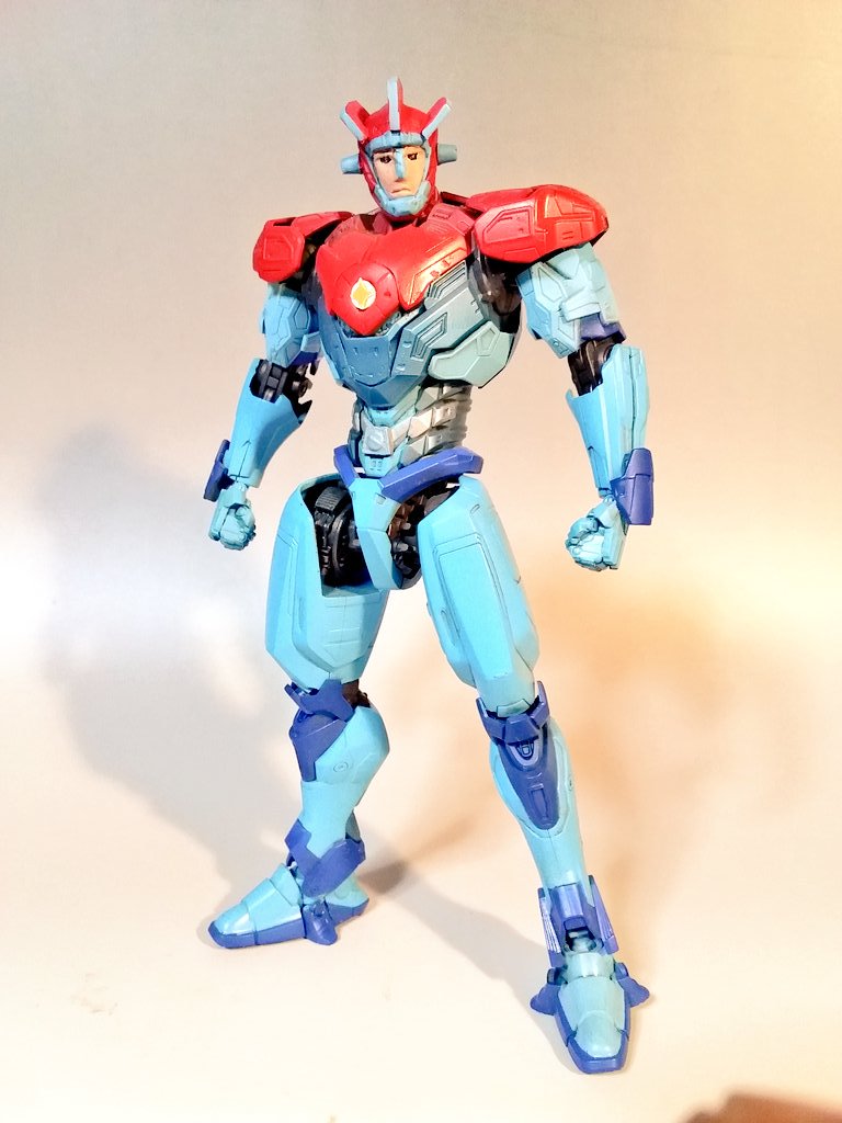 astroganger astroganger_(robot) black_eyes clenched_hands fusion gipsy_avenger jaeger_(pacific_rim) looking_at_viewer mecha model_kit model_kit_(medium) no_humans pacific_rim pacific_rim_uprising pan_pacific_defense_corps photo_(medium) robot shadow takamoriko_(takamo) unconventional_media