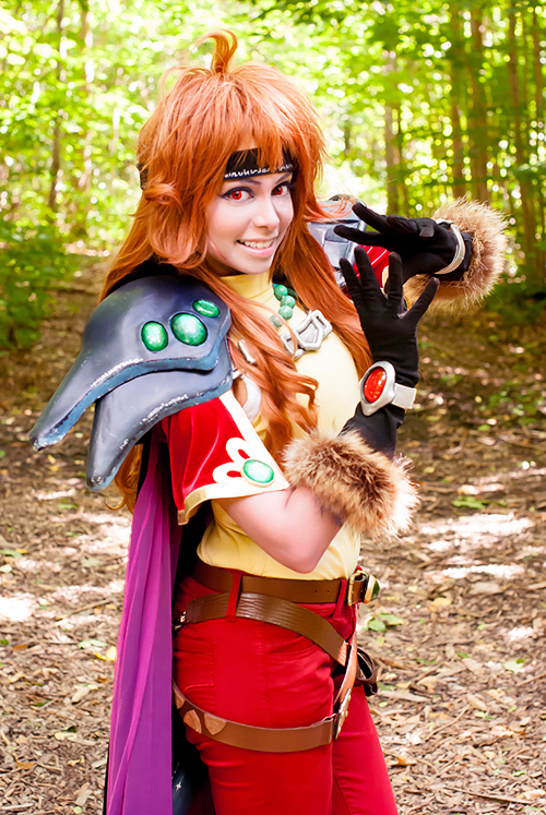 1girl cosplay_photo forest lina_inverse nature photo_(medium) red_eyes slayers smile solo teeth