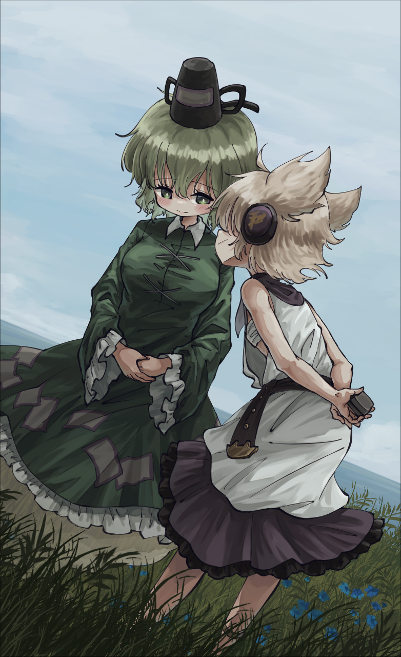 2girls bare_arms black_hat blush brown_hair closed_mouth collared_dress commentary_request contrast_collar day dress earmuffs frilled_dress frilled_sleeves frills ghost_tail grass green_dress green_eyes green_hair hat highres leaning_forward long_sleeves multiple_girls outdoors own_hands_together pointy_hair short_hair sleeveless sleeveless_dress smile soga_no_tojiko standing suteruko tate_eboshi touhou toyosatomimi_no_miko white_dress wide_sleeves