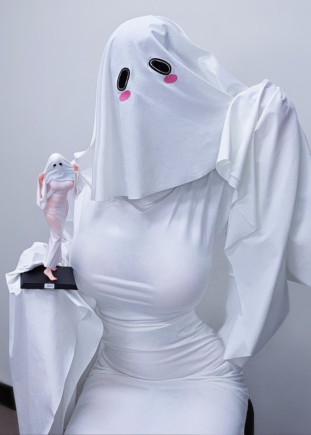 1girl biya_(1024) breasts cosplay_photo covered_face dress figure ghost_costume halloween_costume highres indoors large_breasts original photo_(medium) sheet_ghost sitting sleeves_past_fingers sleeves_past_wrists solo taut_clothes taut_dress white_dress