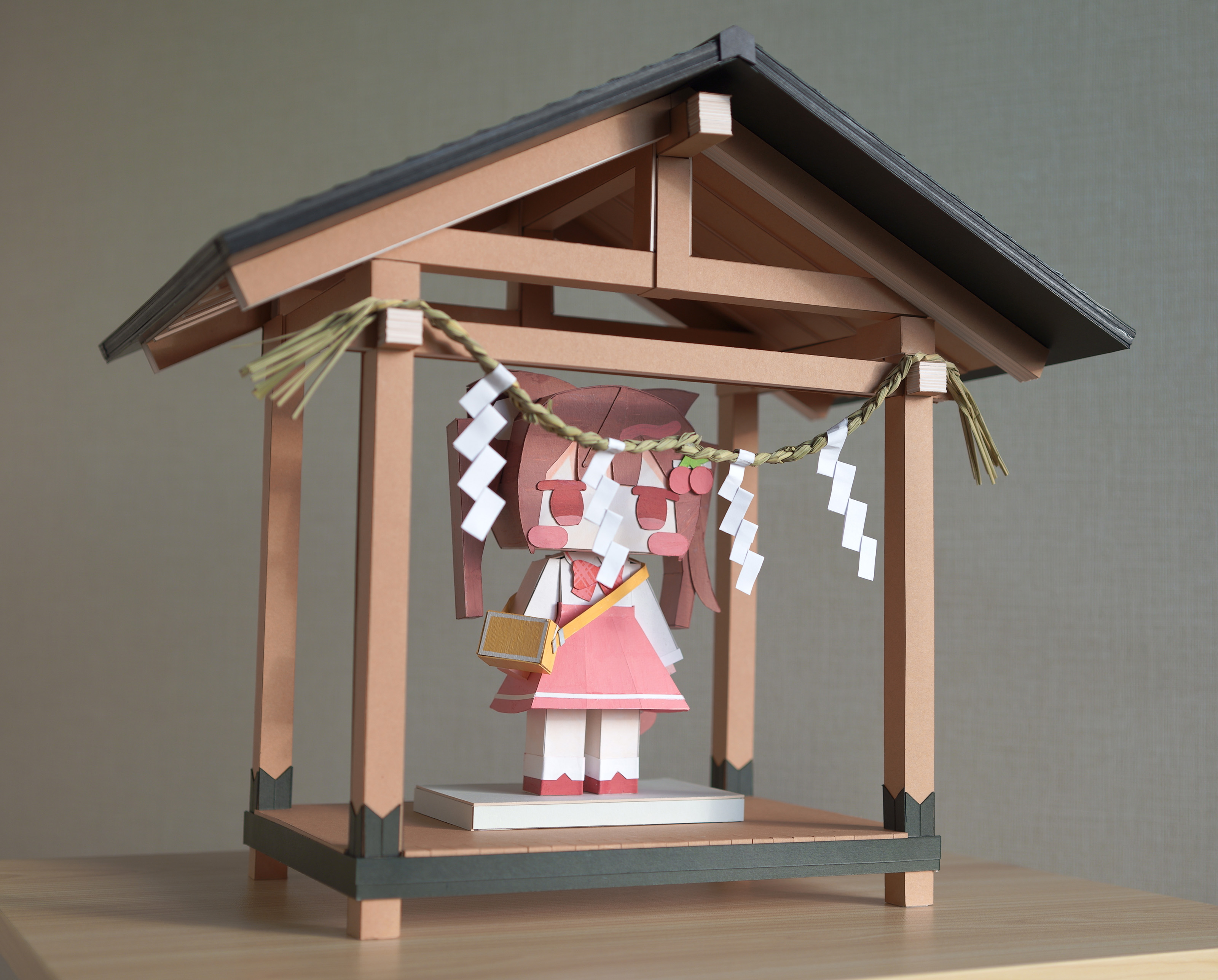 1girl absurdres bag blush_stickers bow brown_hair cherry_hair_ornament chibi comiket_105 commentary_request food-themed_hair_ornament hair_ornament hairclip highres nakkar original papercraft_(medium) photo_(medium) pink_skirt plaid_bow red_eyes red_footwear shide shirt shoulder_bag skirt socks standing twintails unconventional_media white_shirt white_socks