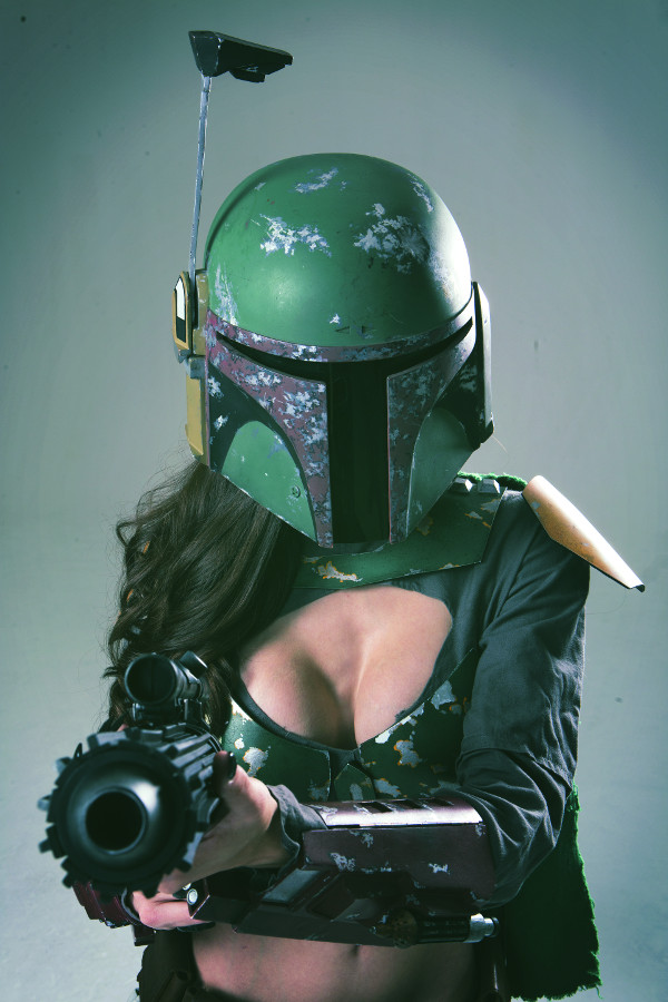 1girl armor black_hair boba_fett boba_fett_(cosplay) breasts cleavage cosplay faceless faceless_female female_focus genderswap genderswap_(mtf) gun helmet long_hair nail_polish photo_(medium) solo star_wars tagme weapon