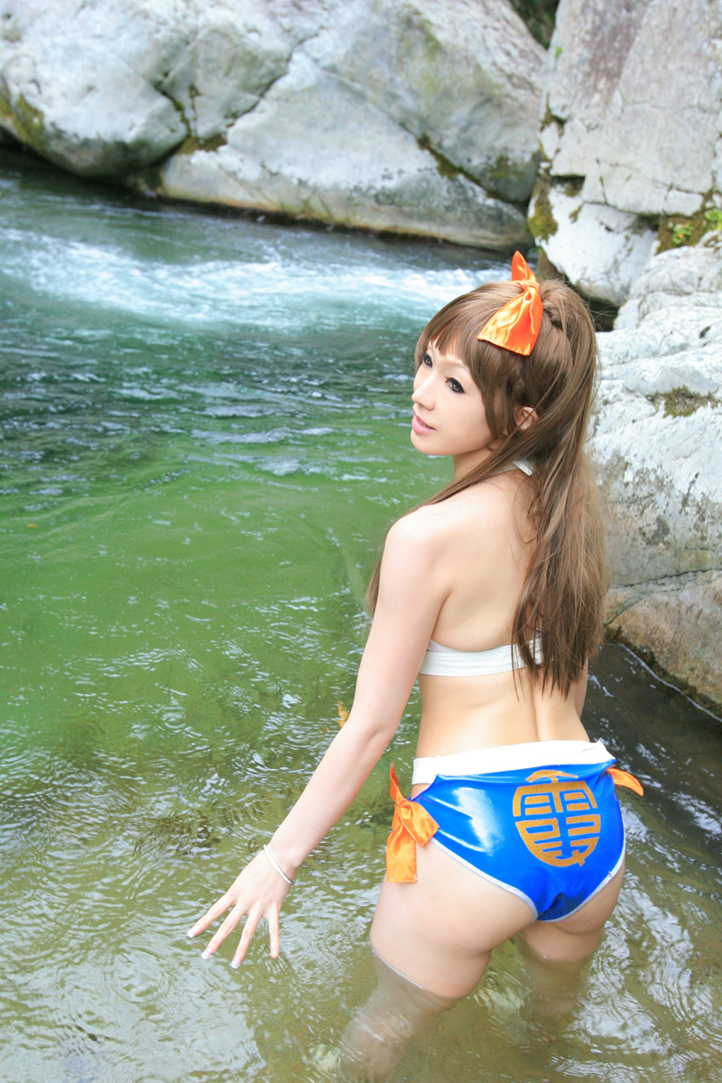 ass bikini brown_hair cosplay dead_or_alive highres igarashi_nao_(model) kasumi_(doa) kasumi_(doa)_(cosplay) long_hair photo_(medium) real_life river swimsuit water