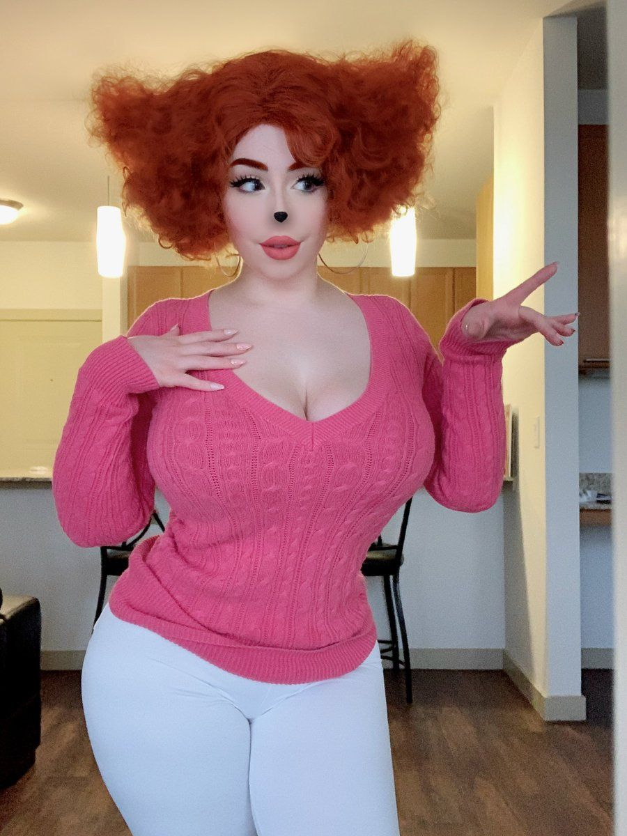 1girl afro blush_(makeup) breasts brown_eyes chair cleavage collarbone cosplay cosplay_photo couch disney extended_hand eyelashes eyeliner female_focus goof_troop hand_on_own_chest highres kitchen lamp large_breasts light lips lipstick makeup medium_hair nail_polish paint_splatter paint_splatter_on_face pants peg_pete peg_pete_(cosplay) photo_(medium) pink_lips pink_nails pink_sweater png_conversion red_hair solo source_request sweater tagme thejulietttemichele thick_thighs thighs white_pants white_wall wide_hips wig wooden_floor