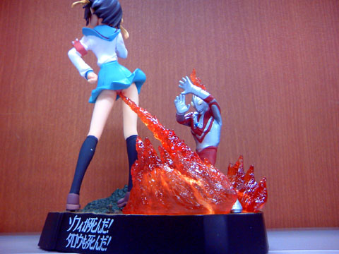 00s 1girl armband black_hair black_legwear blood figure fire lowres menses menstruation photo_(medium) school_uniform serafuku shoes skirt socks superflat suzumiya_haruhi suzumiya_haruhi_no_yuuutsu translated tsuburaya_productions ultra_series ultraman ultraman_(1st_series) ultraman_tarou_(series) what zoffy_(shin)