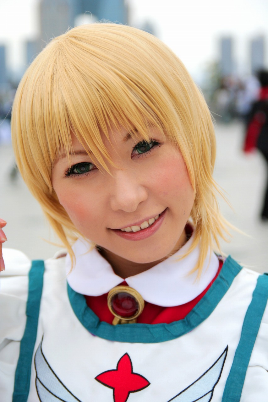 1girl 2007 apron asian blonde_hair blue_eyes chippi color_contacts cosplay erstin_ho erstin_ho_(cosplay) female_focus highres looking_at_viewer maid maid_apron my-otome outdoors photo_(medium) school_uniform short_hair solo watermark web_address