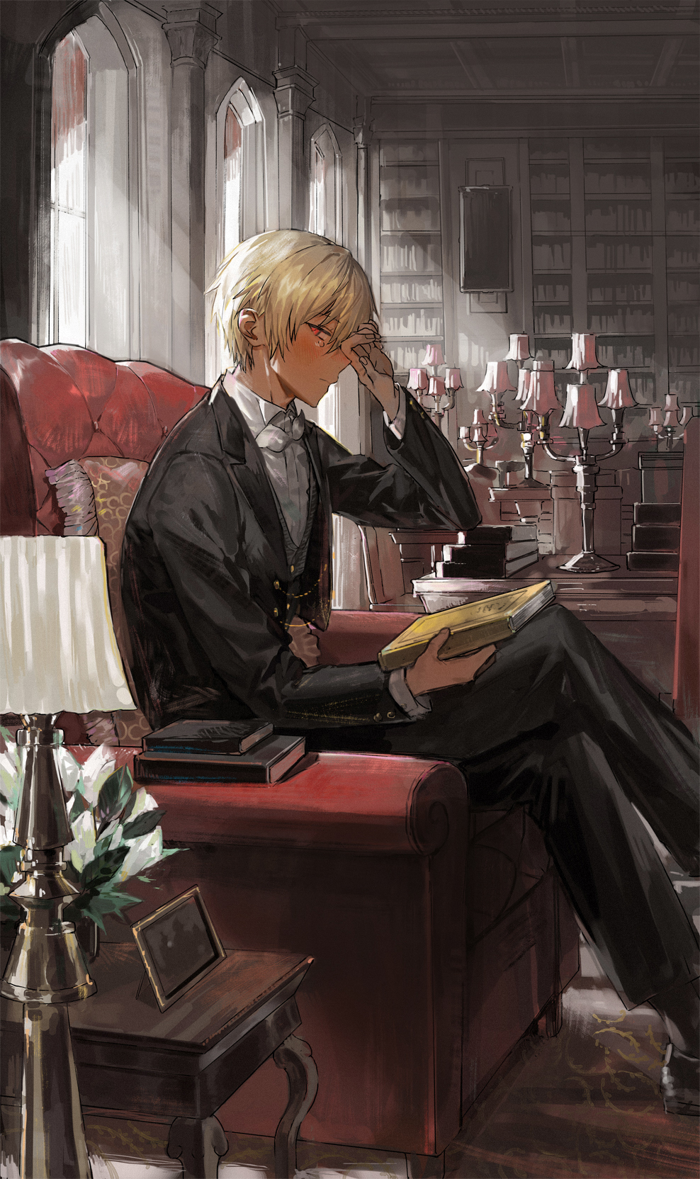1boy black_jacket black_pants black_shoes black_socks blonde_hair blush book bookshelf bow bowtie butler butler_(nana_tetra) closed_mouth commentary_request crossed_legs dark-skinned_male dark_skin desk_lamp feet_out_of_frame fingernails flower full_body grey_vest hand_on_own_face highres holding holding_book indoors jacket lamp looking_at_viewer male_focus nana_tetra on_chair original pants picture_frame plant red_eyes shirt shoes short_hair sitting socks solo sunlight teardrop vest white_bow white_bowtie white_shirt window