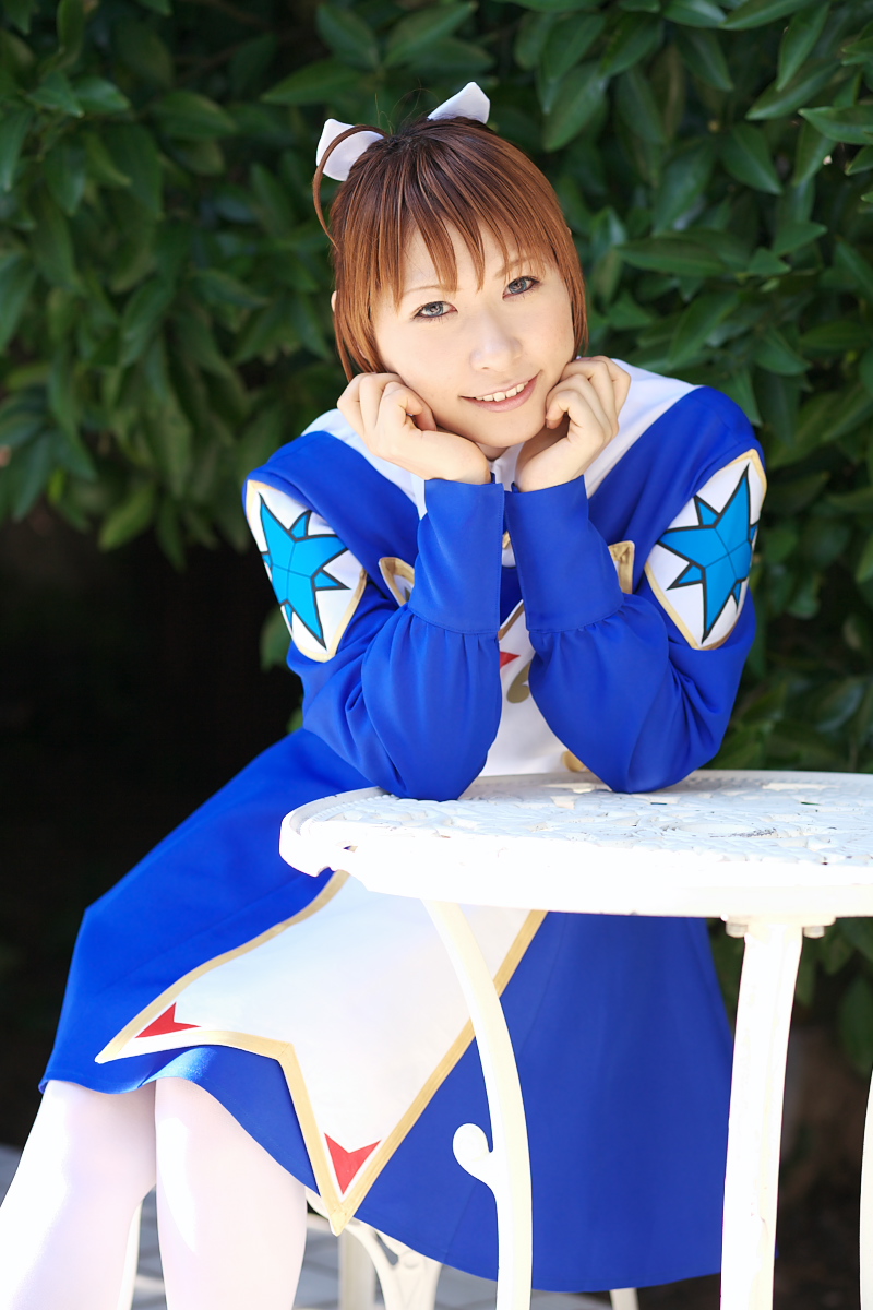1girl arika_yumemiya arika_yumemiya_(cosplay) asian blue_eyes blurry braid chippi color_contacts cosplay depth_of_field female_focus highres long_hair looking_at_viewer my-otome outdoors photo_(medium) school_uniform sitting smile solo table twin_braids ultimate_blue_sky white_legwear