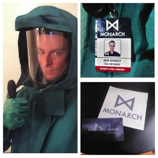 1boy badge conspiracy cosplay godzilla_(2014) godzilla_(series) hazmat_suit jack_keighly king_kong_(series) legendary_pictures looking_at_viewer monarch_(monsterverse) monsterverse real_life text_focus toho viral_marketing