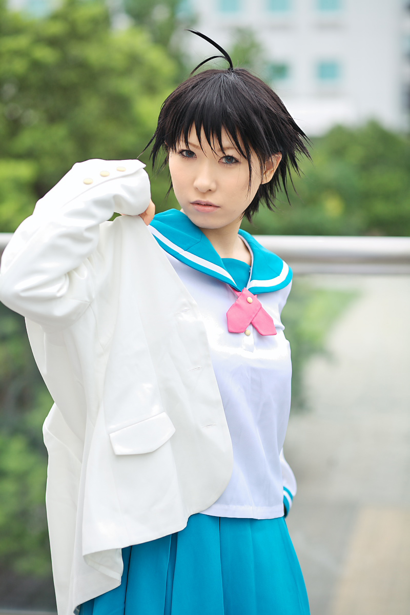1girl ahoge asian black_hair blue_eyes chippi color_contacts cosplay female_focus highres idolmaster idolmaster_xenoglossia kikuchi_makoto kikuchi_makoto_(cosplay) looking_at_viewer outdoors photo_(medium) school_uniform serafuku short_hair solo