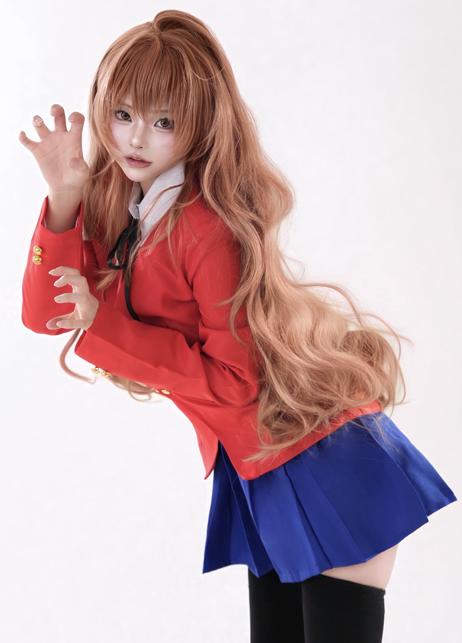 1girl aegyo_sal aisaka_taiga black_ribbon black_thighhighs blue_skirt brown_eyes brown_hair commentary cosplay_photo cowboy_shot from_side highres i_fu93 jacket long_hair long_sleeves looking_at_viewer looking_to_the_side miniskirt neck_ribbon open_mouth paw_pose photo_(medium) red_jacket ribbon shirt simple_background skirt solo symbol-only_commentary thighhighs toradora! very_long_hair white_background white_shirt zettai_ryouiki