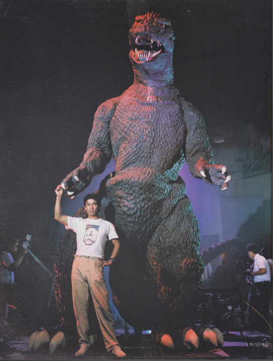 4boys animatronic behind_the_scenes camera claws dinosaur full_body giant giant_monster godzilla godzilla_(series) kaiju monster multiple_boys robot sharp_teeth short_hair tail teeth the_return_of_godzilla toho tongue