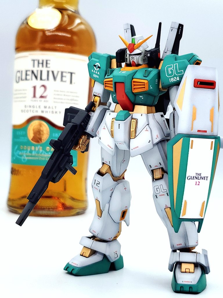 alcohol beam_rifle energy_gun gun gundam gundam_mk_ii holding holding_gun holding_weapon liquor mecha mecha_focus mj_(matsujun24) mobile_suit model_kit_(medium) no_humans photo_(medium) product_placement robot shadow sponsor the_glenlivet unconventional_media v-fin weapon zeta_gundam