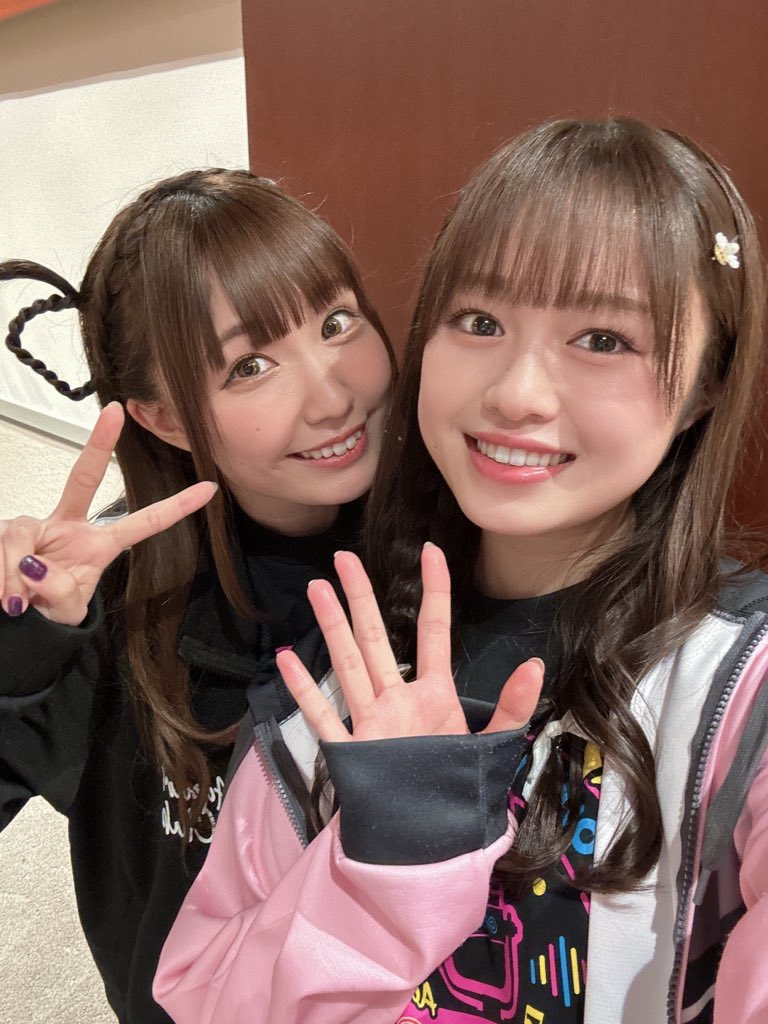 2girls emori_aya indoors looking_at_viewer multiple_girls photo_(medium) selfie smile standing suzuki_aina_(ero_mangaka-san_to_binbou_shimai) voice_actor