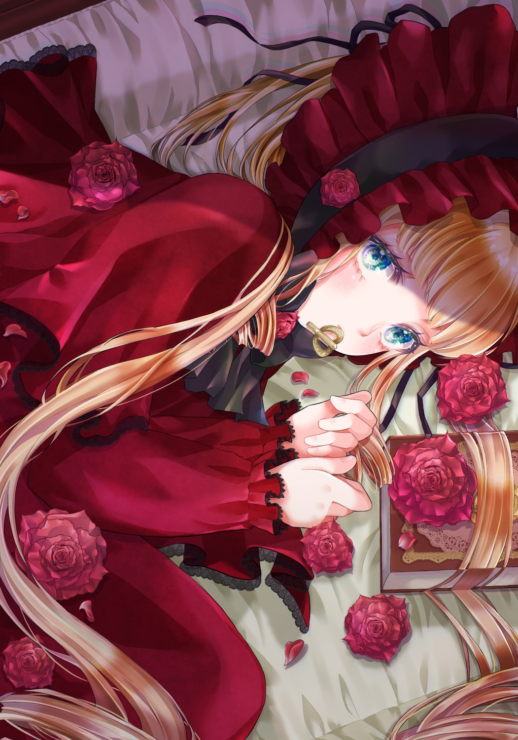 1girl ascot blonde_hair blue_eyes bonnet book capelet commentary_request dress fetal_position flower frilled_bonnet frills grimoire highres lace-trimmed_capelet lace-trimmed_sleeves lace_trim long_hair long_sleeves looking_at_viewer lying mouth_hold on_side red_ascot red_bonnet red_capelet red_dress red_flower red_rose rose rozen_maiden shinku solo tm_(pixiv45602758) very_long_hair winding_key