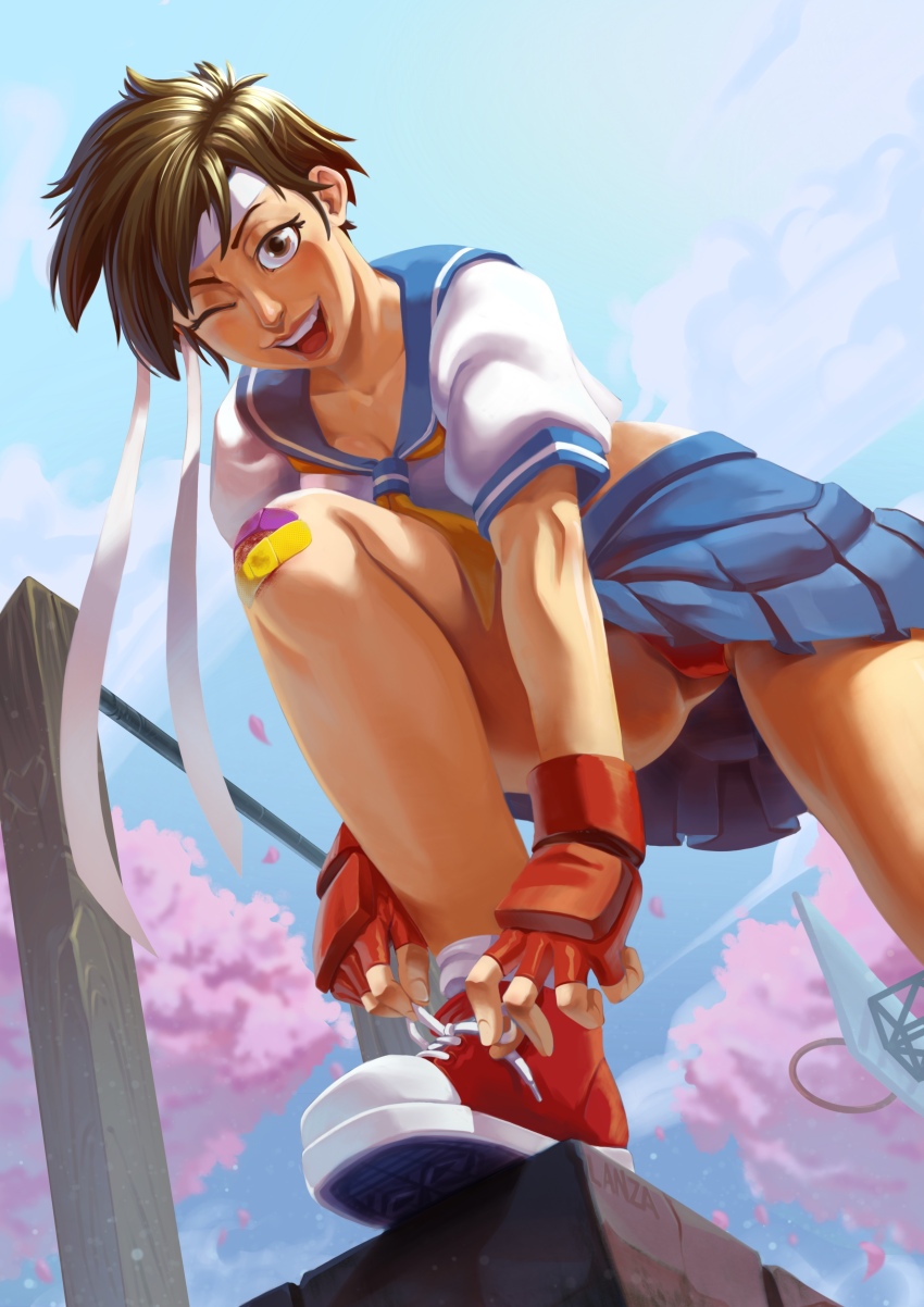 1girl absurdres bandaid bandaid_on_knee bandaid_on_leg blue_serafuku blue_skirt brown_eyes brown_hair bruise_on_knee cherry_blossoms cloud cloudy_sky commentary converse crop_top day english_commentary fingerless_gloves from_below gloves headband highres kasugano_sakura leg_up looking_at_viewer one_eye_closed open_mouth panties pantyshot red_gloves red_panties red_shoes school_uniform serafuku shoes short_hair sketch_lanza skirt sky smile sneakers socks solo street_fighter street_fighter_zero_(series) teeth tomboy tying_footwear underwear upper_teeth_only upskirt white_headband white_socks