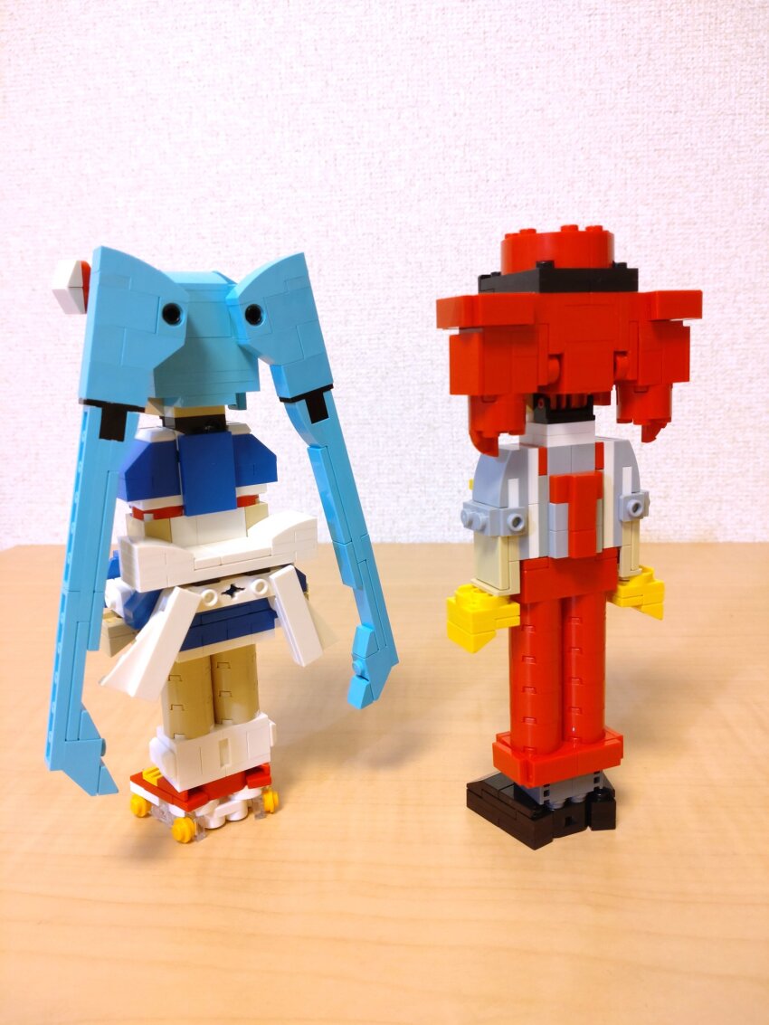 2girls alternate_costume back_bow black_footwear blue_dress blue_hair bow choroli_(chorolin) dress drill_hair from_behind full_body gloves grey_shirt hat hatsune_miku highres kasane_teto lego_(medium) long_hair mesmerizer_(vocaloid) multiple_girls pants puffy_short_sleeves puffy_sleeves red_footwear red_hair red_hat red_pants roller_skates shirt shoes short_dress short_sleeves skates sleeves_rolled_up socks standing suspenders twin_drills twintails unconventional_media very_long_hair vocaloid white_socks yellow_gloves