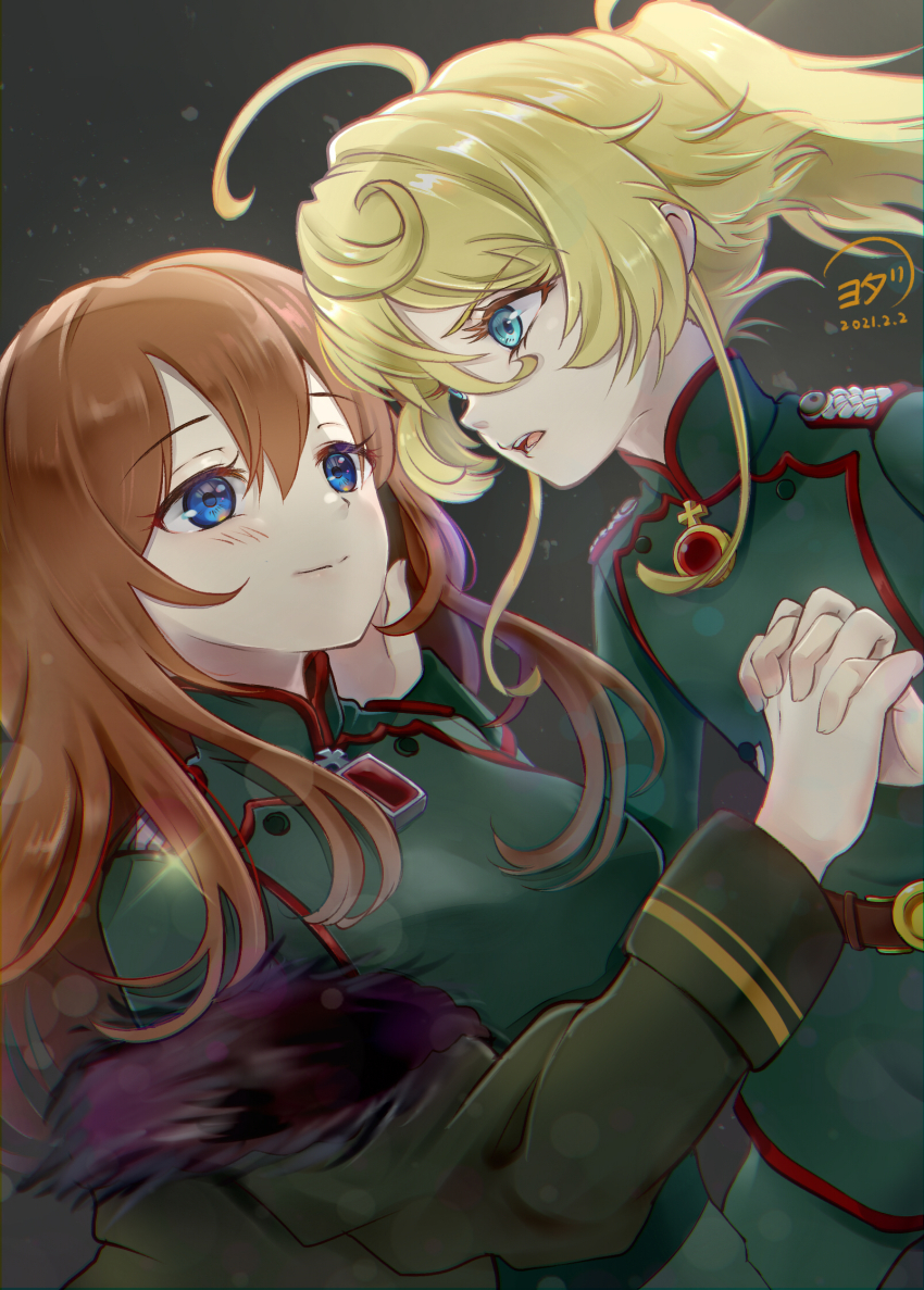 2girls ahoge belt blonde_hair blue_eyes blush brown_belt brown_hair closed_mouth commentary_request cross dated fur-trimmed_jacket fur_trim gem green_jacket green_pants grey_background hair_between_eyes hand_on_another&#039;s_face hand_up high_ponytail highres holding_hands huge_ahoge iron_cross jacket long_hair long_sleeves looking_at_another mandarin_collar military_jacket military_uniform multiple_girls open_clothes open_jacket open_mouth pants ponytail red_gemstone sidelocks signature simple_background smile sparkle tanya_degurechaff teeth viktoriya_ivanovna_serebryakov youda_(seravichacha) youjo_senki yuri