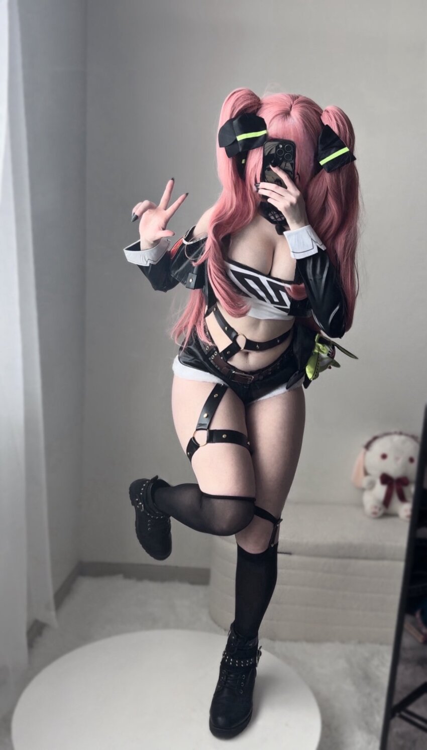 1girl breasts cleavage cosplay full_body hair_ornament highres kltt3y large_breasts legs long_hair nicole_demara nicole_demara_(cosplay) phone pink_hair presenting real_life selfie bad_tag sexually_suggestive shorts solo twintails v zenless_zone_zero