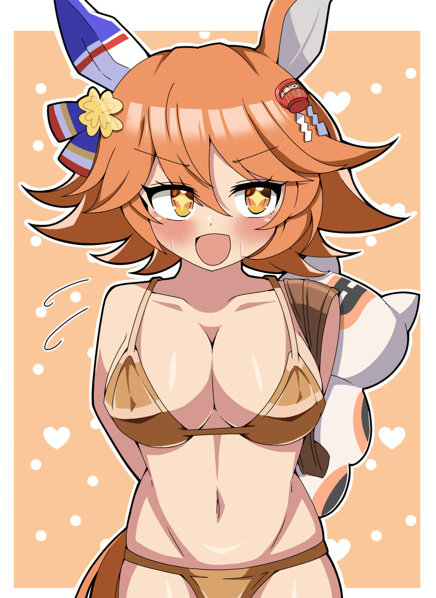 +_+ 1girl absurdres animal_ears arms_behind_back averting_eyes bikini blush border breasts cleavage clover_hair_ornament collarbone commentary_request cowboy_shot daruma_doll ear_covers flipped_hair four-leaf_clover_hair_ornament gold_bikini hair_between_eyes hair_ornament heart highres holding horse_ears horse_girl horse_tail ken725011186 large_breasts looking_to_the_side maneki-neko matikanefukukitaru_(umamusume) navel open_mouth orange_background orange_hair outside_border short_hair single_ear_cover smile solo stomach swimsuit tail umamusume white_border yellow_eyes