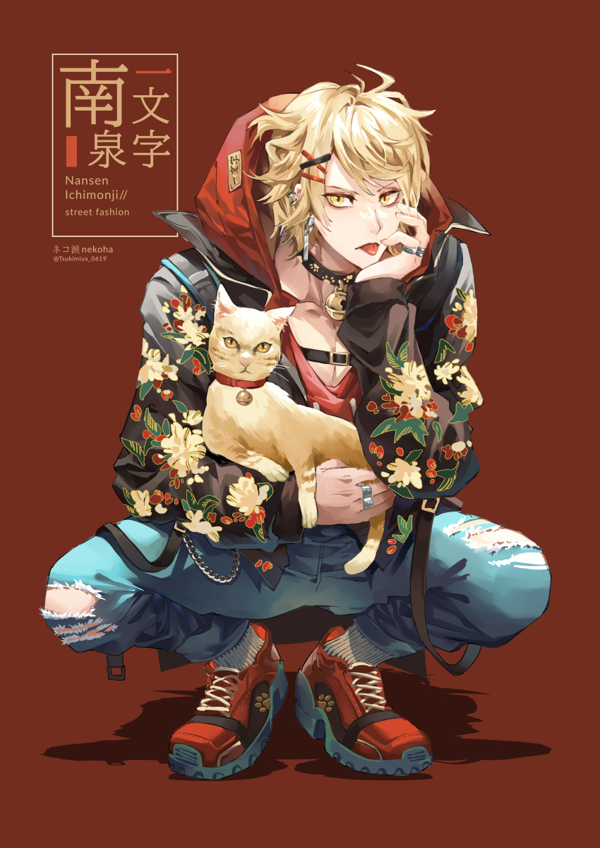 1boy :p absurdres ahoge animal bell belt black_jacket blonde_hair blue_pants casual cat character_name choker denim floral_print full_body hair_ornament hairclip hand_on_own_cheek hand_on_own_face head_rest highres holding holding_animal hood hoodie jacket jeans jewelry jingle_bell long_sleeves looking_at_viewer male_focus nansen_ichimonji neck_bell pants paw_print print_jacket red_background red_hoodie red_shoes ring shoes short_hair simple_background sneakers socks solo squatting tongue tongue_out torn_clothes torn_jeans torn_pants touken_ranbu tsukimiya_akira white_socks x_hair_ornament yellow_eyes