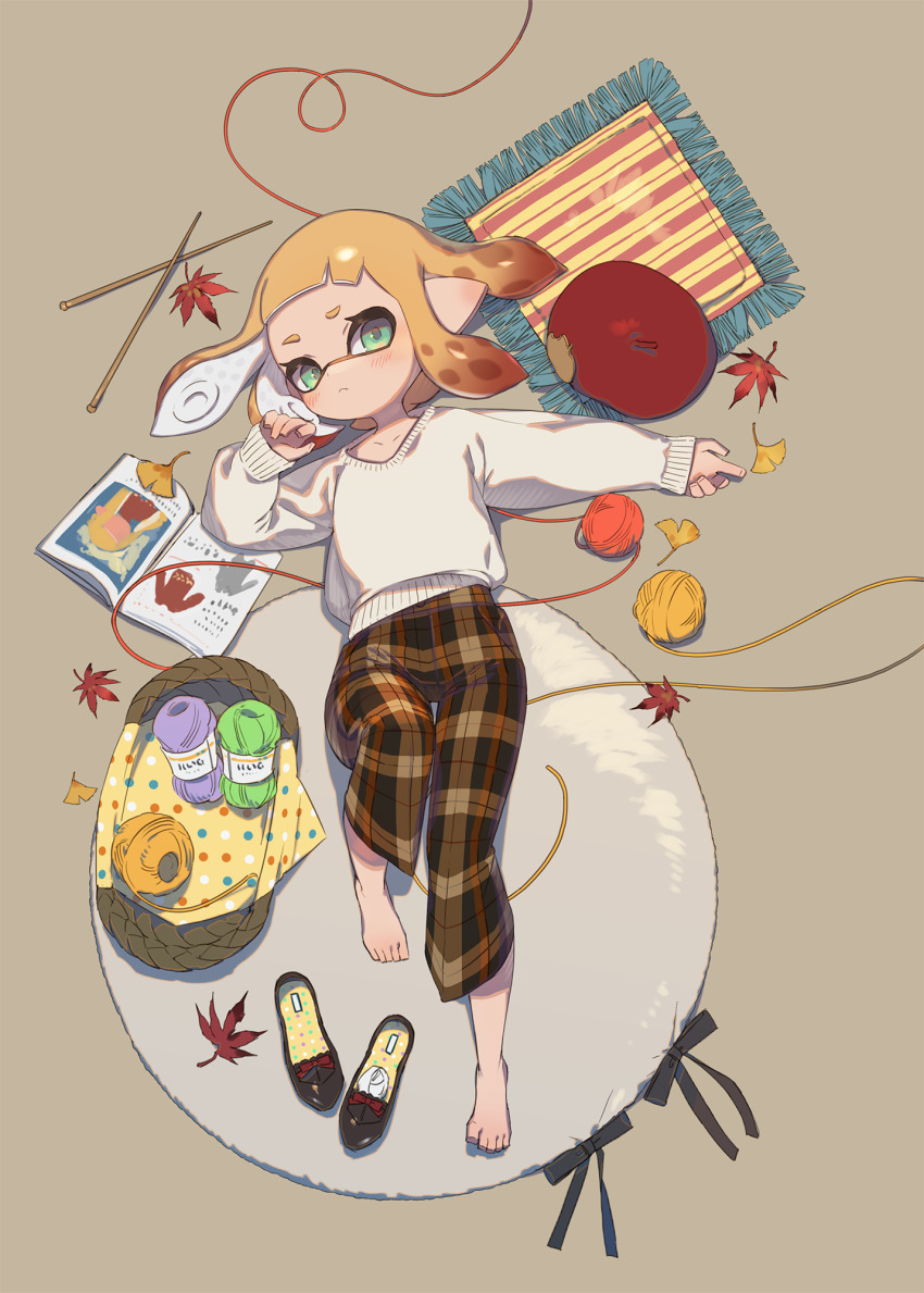 1girl :&lt; autumn_leaves barefoot black_shoes blonde_hair blush book brown_background brown_pants closed_mouth collarbone commentary_request full_body ginkgo_leaf green_eyes hand_up highres inkling inkling_girl inkling_player_character knitting_needle leaf leg_up long_sleeves lying needle nintendo on_back open_book pants plaid_clothes plaid_pants pointy_ears rug shoes short_hair simple_background solo splatoon_(series) sweater tentacle_hair unworn_shoes white_sweater yarn yarn_ball yu-ri_(arium047)