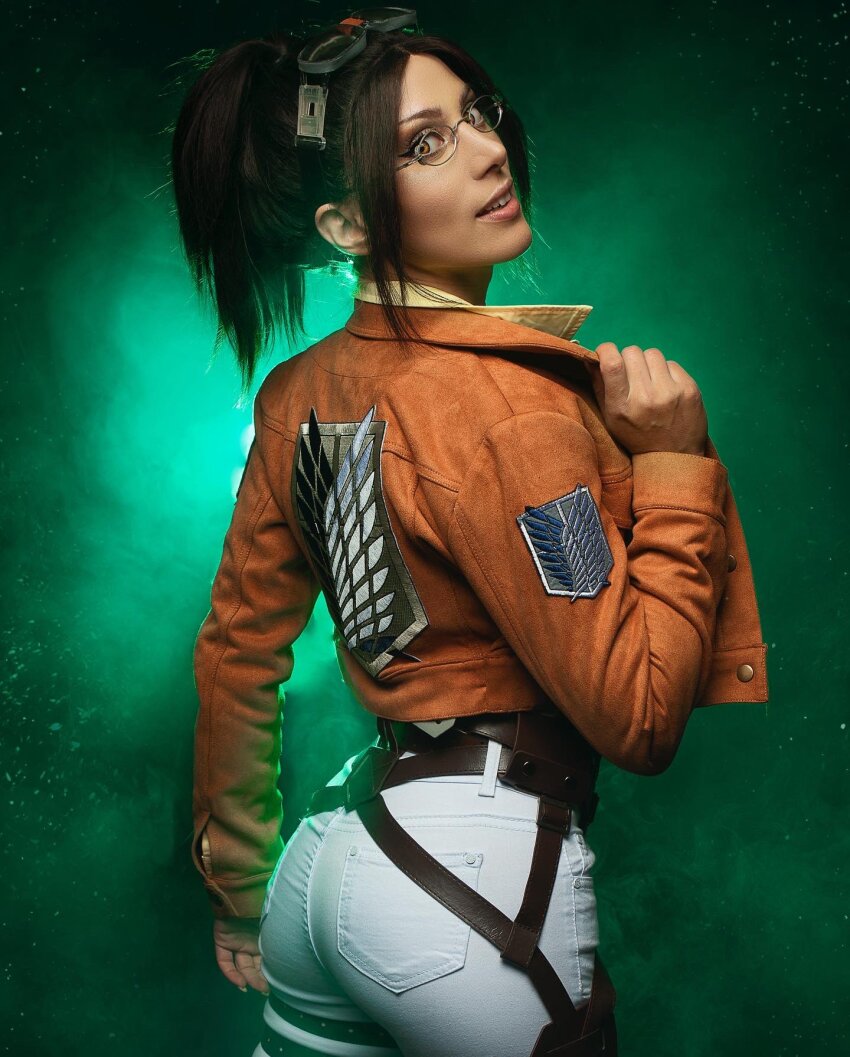 1girl adjusting_eyewear ass brown_hair brown_jacket collared_jacket cosplay cosplay_photo elizabeth_rage female_focus glasses hange_zoe hange_zoe_(cosplay) highres jacket looking_at_viewer looking_back military_jacket open_clothes open_jacket paradis_military_uniform parted_bangs photo_(medium) ponytail real_life shingeki_no_kyojin solo survey_corps_(emblem)