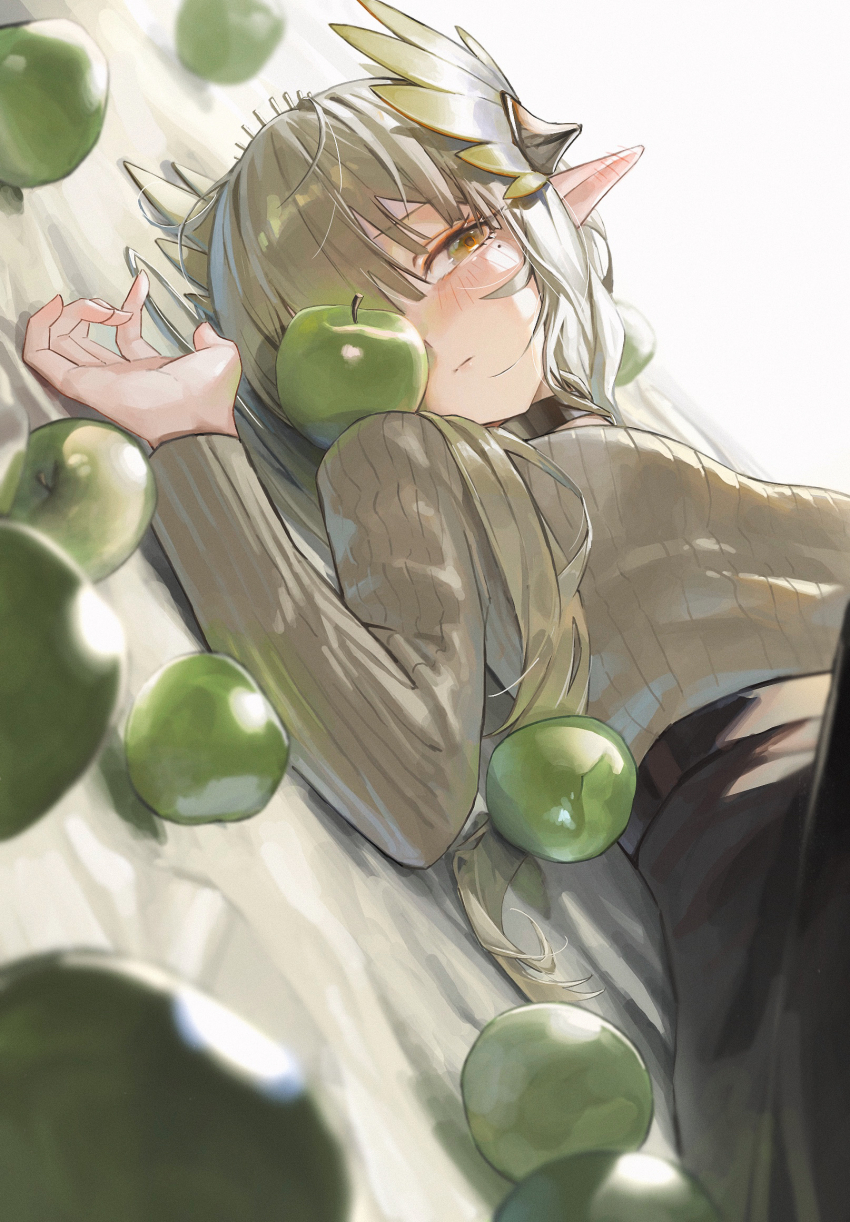 1girl apple arknights black_choker black_skirt blush breasts brown_hair brown_sweater choker closed_mouth commentary_request ear_blush elf food fruit green_apple hand_up highres knees_up laurel_crown long_hair long_sleeves lying mole mole_under_eye muelsyse_(arknights) on_back pointy_ears ribbed_sweater skirt small_breasts solo sweater watanab1019 yellow_eyes