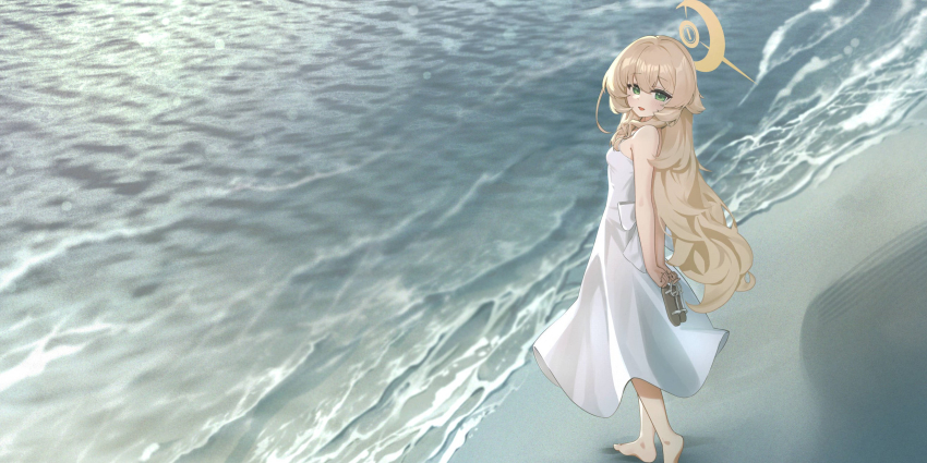arms_behind_back bare_shoulders barefoot beach blonde_hair blue_archive ciza_gomi dress green_eyes halo highres holding holding_shoes long_hair professor_niyaniya_(blue_archive) sand shoes sundress water white_dress