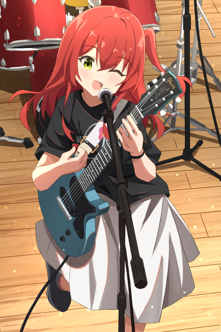 1girl :d absurdres black_shirt black_shoes blush bocchi_the_rock! breasts cable chinosuke_(cs4126) commentary_request double-parted_bangs drum electric_guitar gibson_les_paul green_eyes grey_skirt guitar guitar_strap highres holding holding_guitar holding_instrument holding_plectrum instrument kita_ikuyo leg_up long_skirt looking_at_viewer medium_hair microphone microphone_stand music one_eye_closed one_side_up open_mouth playing_instrument plectrum red_hair shirt shoes skirt small_breasts smile solo standing wooden_floor wristband