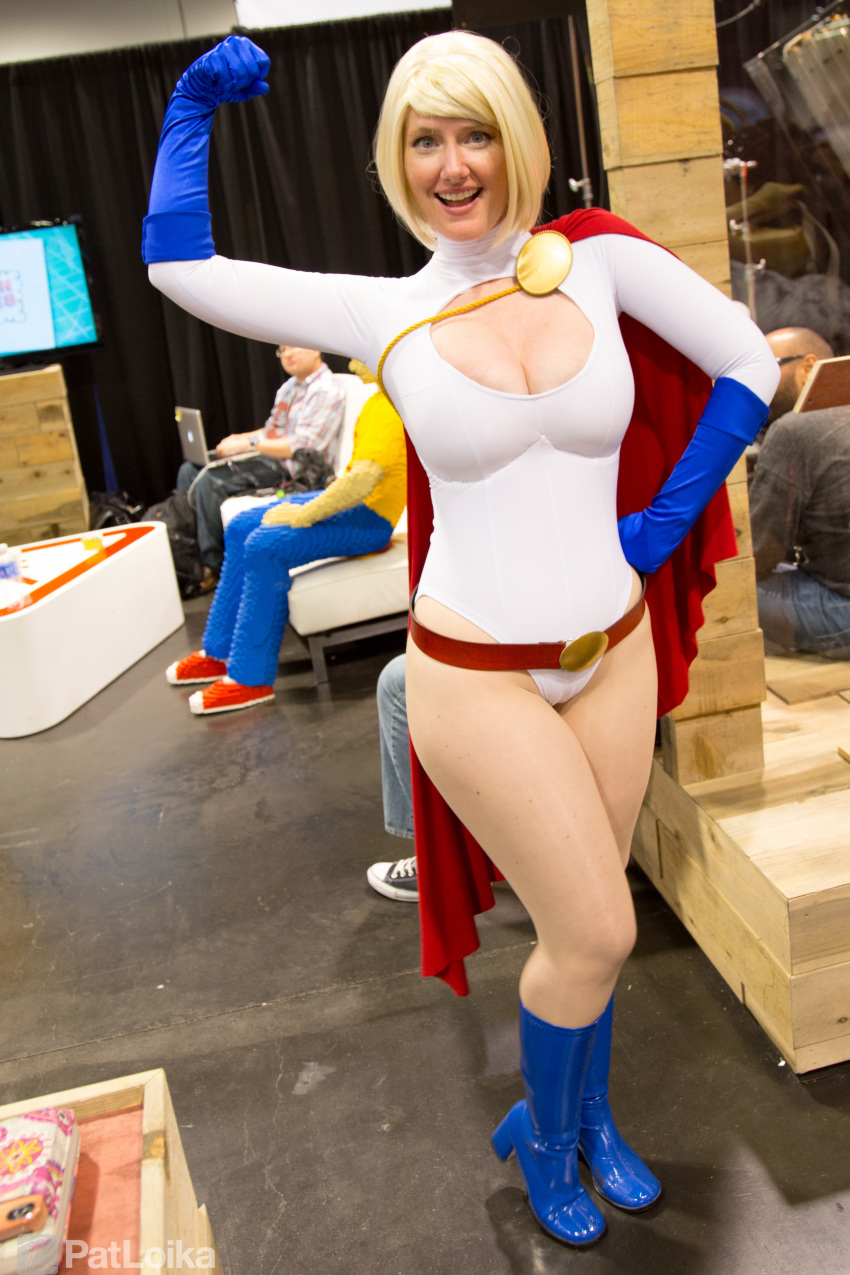 absurdres belt blonde_hair boots breasts cape cleavage cleavage_cutout clothing_cutout cosplay dc_comics gloves highres leotard photo_(medium) power_girl power_girl_(cosplay)