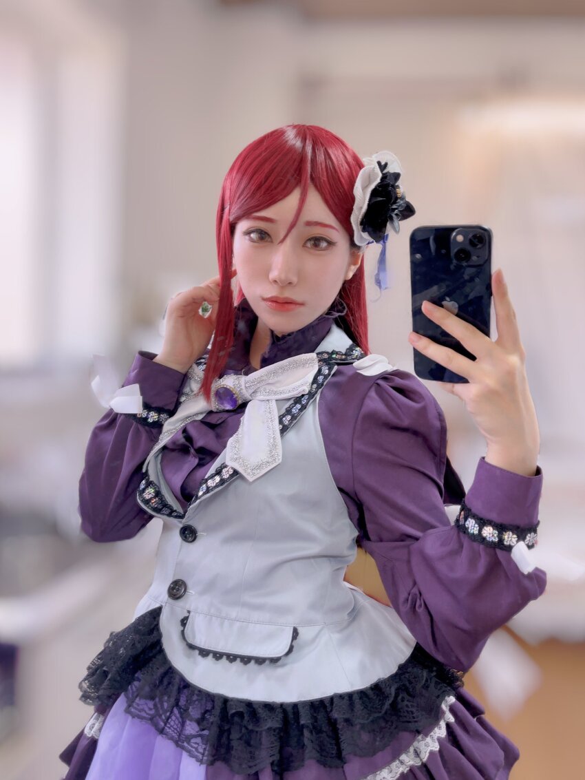 1girl blurry blurry_background cellphone cosplay cosplay_photo costume guilty_kiss_(love_live!) honamen_cos indoors long_hair looking_at_viewer love_live! love_live!_sunshine!! phone photo_(medium) red_hair sakurauchi_riko smartphone standing yellow_eyes