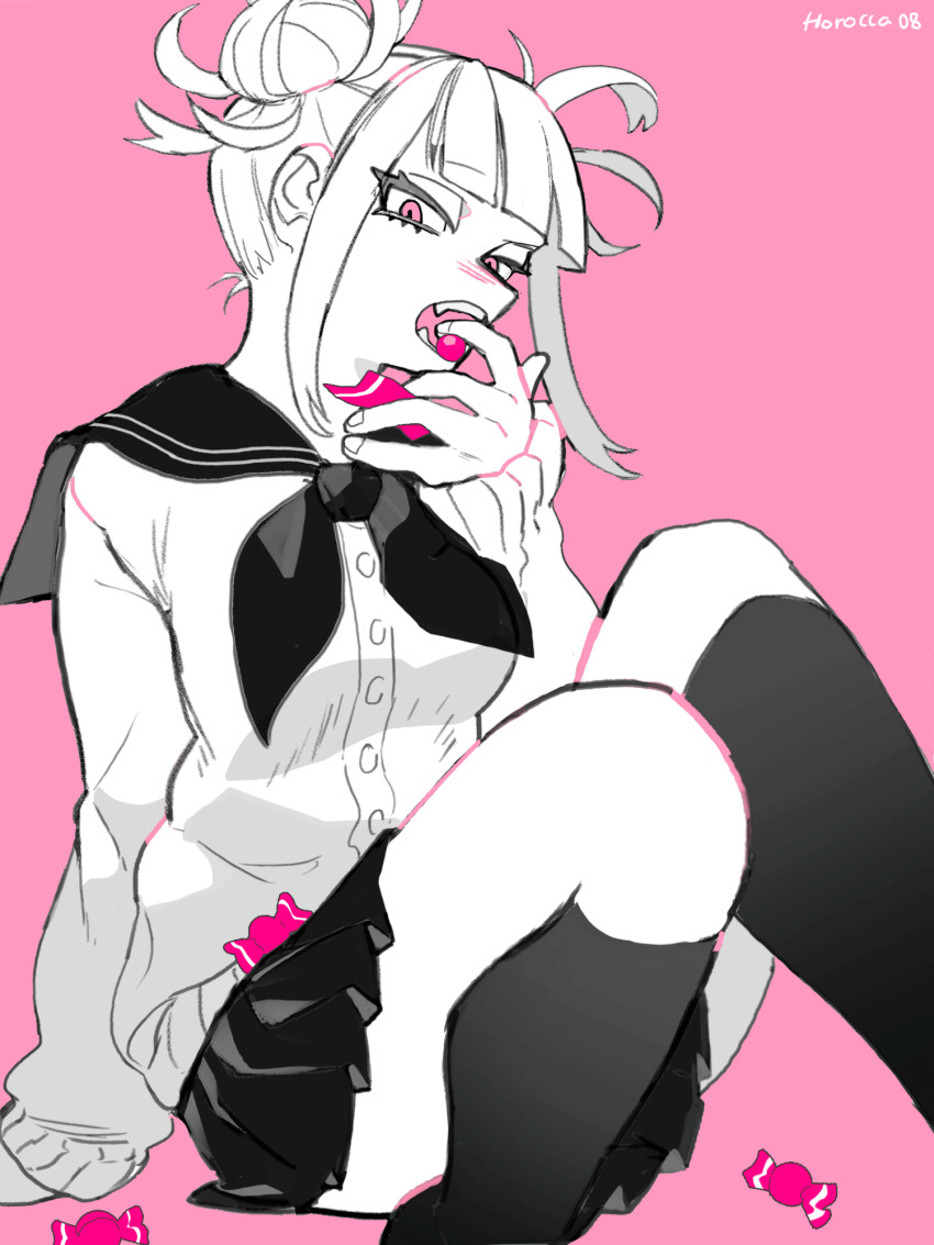 1girl arm_support black_neckerchief black_sailor_collar black_skirt blunt_bangs blush boku_no_hero_academia candy cardigan double_bun eating fangs feet_out_of_frame finger_in_own_mouth food greyscale hair_bun highres holding holding_candy holding_food horocca kneehighs looking_at_viewer messy_hair monochrome narrowed_eyes neckerchief nose_blush open_mouth pink_background sailor_collar signature sitting skirt socks solo thighs toga_himiko tsurime white_cardigan