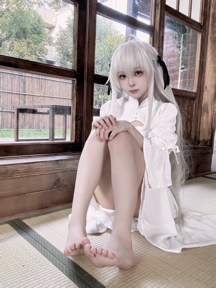 asian bare_legs black_eyes cosplay_photo dress highres indoors kasugano_sora photo_(medium) shi_liang_yu sitting white_dress white_hair yosuga_no_sora